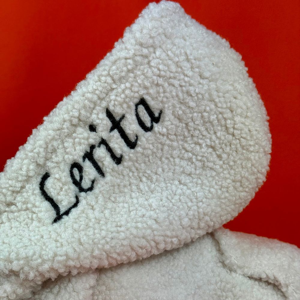 Close-up of a hood embroidered with the name Lerita